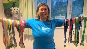 Clare triumphs with over £25,000 raised  in triathlon challenge